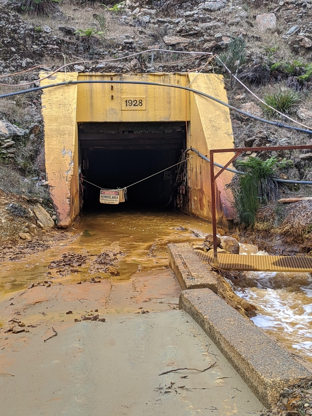 Heavily contaminated water flowing out of a mine entrance