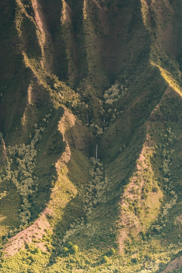 Hidden waterfalls in the majestic ridges of Kalalau Valley - Kauai Hawaii 
