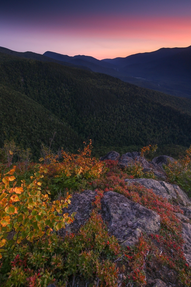 High altitude smoke and early fall leaves combined for a colorful sunset at the Imp Face ledges White Mountains NH Peak leaves are probably only  weeks away in New Hampshire 