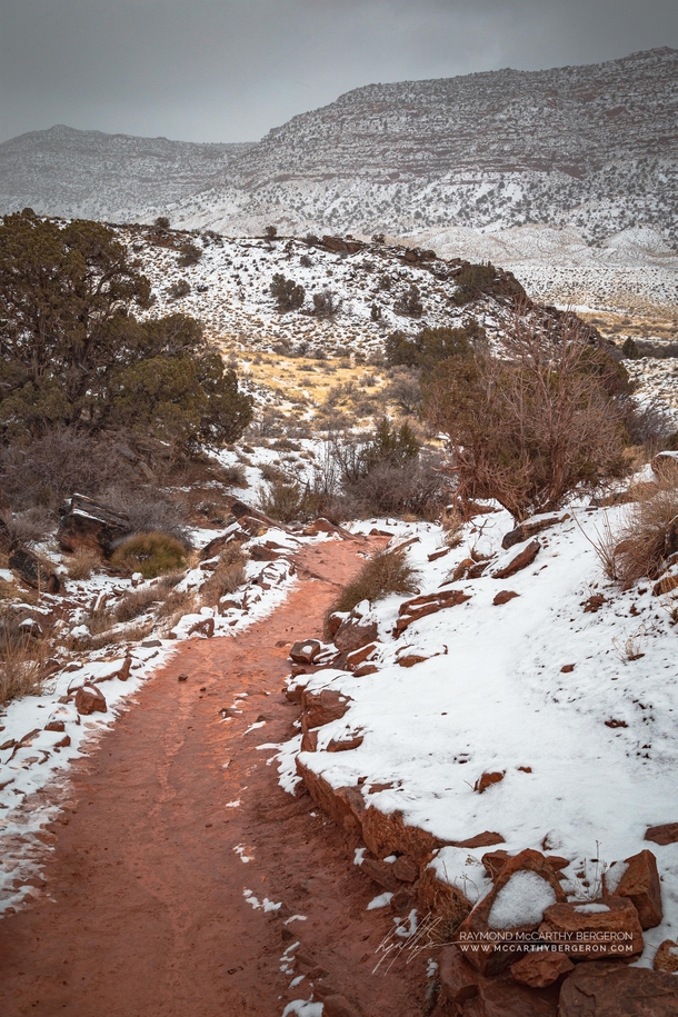 Hiking on red clay into the white landscape in Arches National Park Utah 