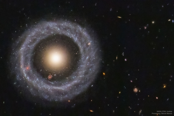 Hoags Object This non-typical ring galaxy about  million light-years away is made up of a nearly perfect ring of young blue stars circling the yellow nucleus consisting of much older stars The galaxy is about  light-years across  Image Credit NASAESA and 