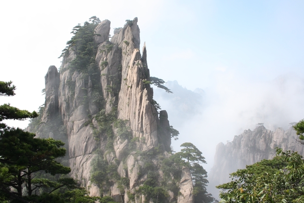 Huangshan with trees and clouds southern Anhui province in eastern China  by Arne Hckelheim
