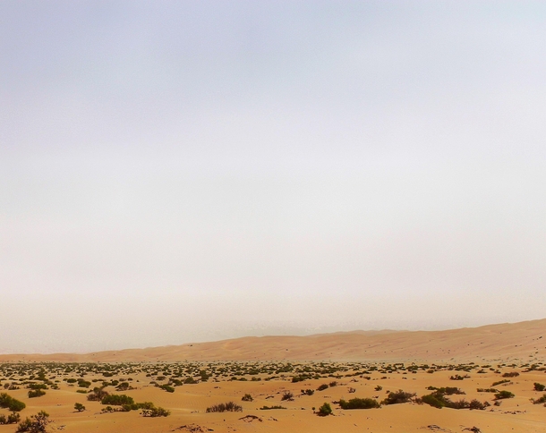 I am in the Liwa Dunes in the southern United Arab Emirates That haze in the background is sand blown up by  mph winds 