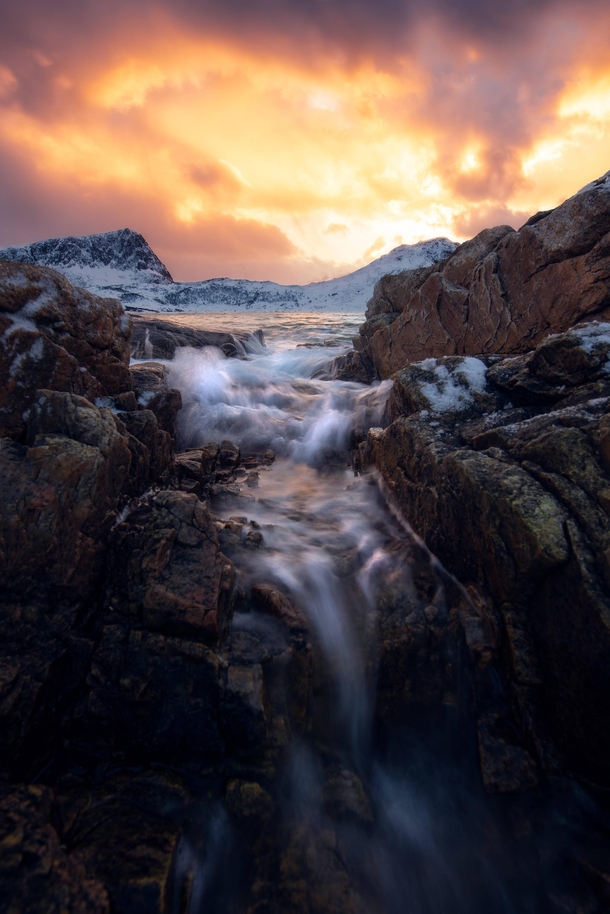 I did indeed get wet for this photo Coastal sunset on the Lofoten Islands Norway 