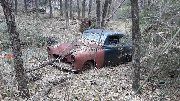 I found this old car while walking in the woods 