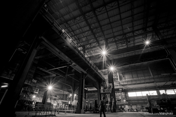 I stand below the upper platform of a metal works factory in Belgium the sheer awe of the size of the machinery there left us with jaws wide open  x