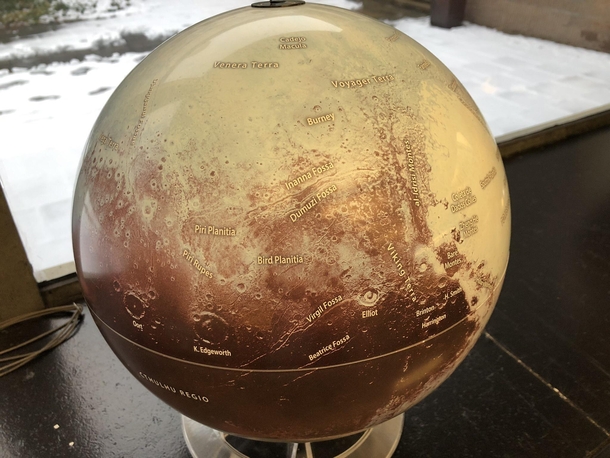 I went back to the astronomy library and took a picture of the Pluto globe for you guys My favorite named region is in the lower left