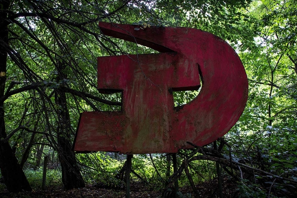 I went into Chernobyl Exclusion Zone  times and documented every memorial and monument Ive found This Hammer and Sickle Sign is in the abandoned village of Stechanka Ukraine Exclusion Zone located just outside of the former village club 