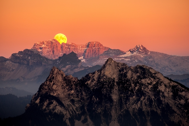 I went out to capture the sunset but then looked towards the other side and saw this incredible moonrise happening simultaneously Mount Gnipen Switzerland 