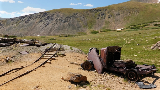 Im always curios as to how these old abandoned vehicles made it into the mountains Top of Butler Gulch Trail Colorado USA Pile of rust is was a  Plymouth