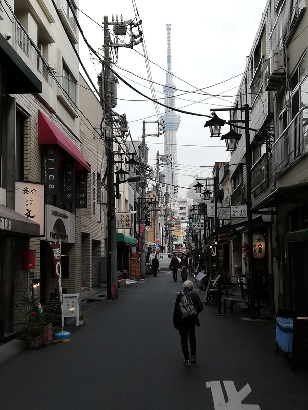 Im jumping on the Tokyo train today Here a shot of a side street in Asakusa with the Skytree in the background