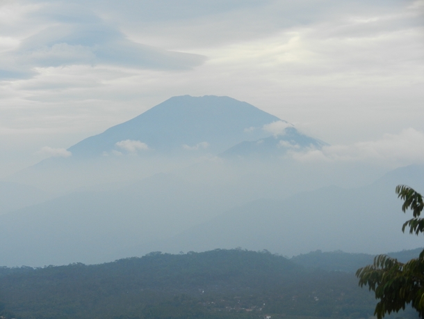 Indonesian volcano emerging from the clouds  x