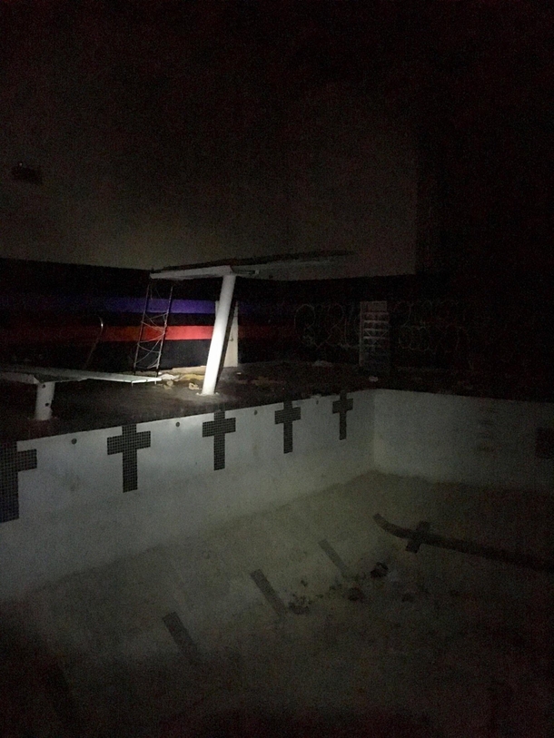 indoor pool at an abandoned college gym 