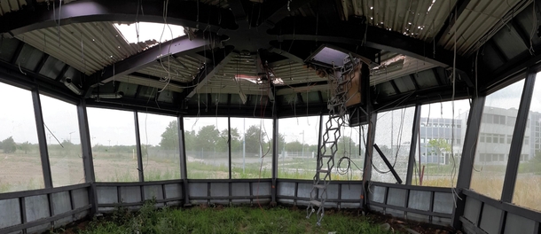Inside the left over cab of a demolished air traffic control tower