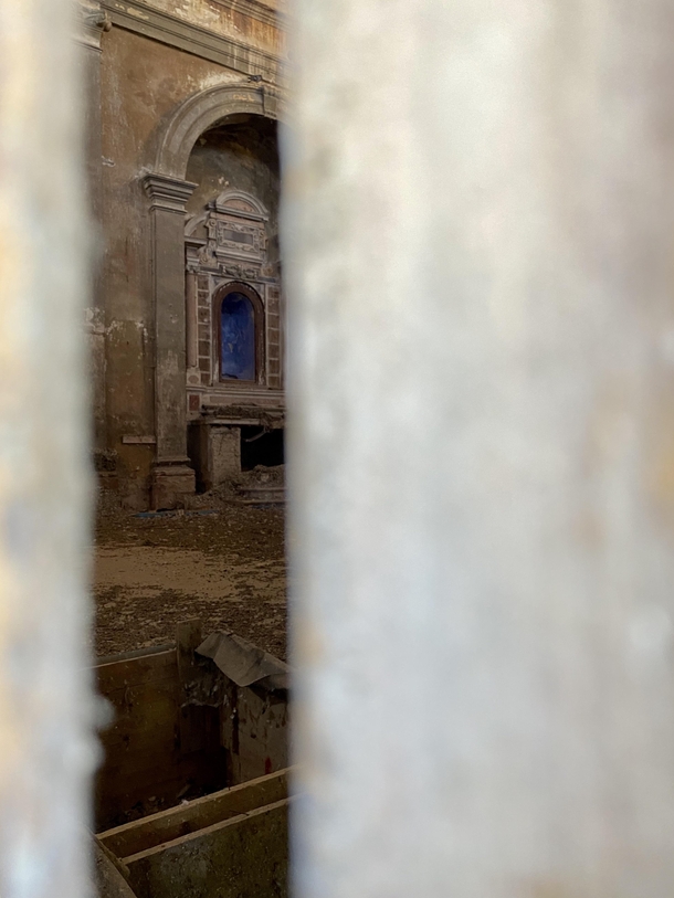 Interior of the abandoned church of San Giovanni Battista Correzzo province of Verona region Veneto Italy I could not enter so I took a photo from a crack in a door