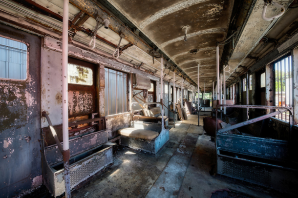 Interior picture of Coney Island Subway Car  that was found abandoned in a grassy field in Springfield photo by Walter Arnold with link to more great abandoned pictures 