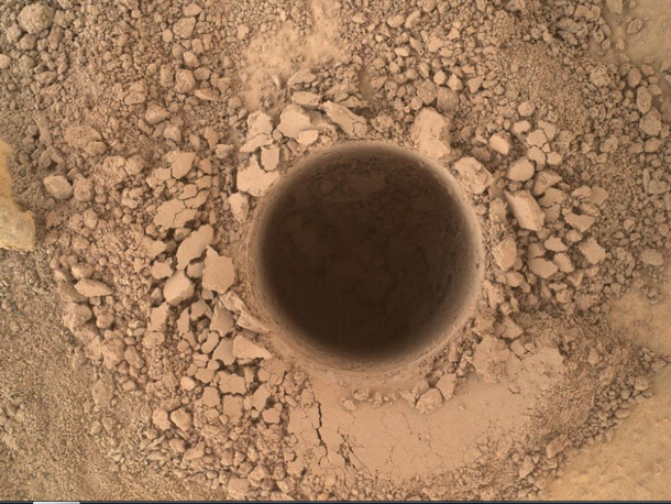 It may look like just a hole in the dirt but this is the first sampling hole made by the Curiosity at Mt Sharp the rovers ultimate science destination