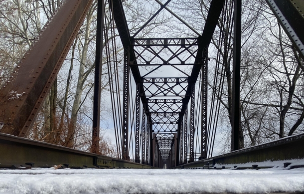 ITAP of an abandoned train bridge after a light snow