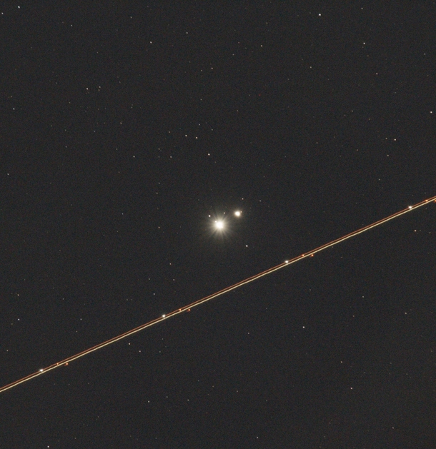 Jupiter Saturn and a Airplane Passing By 