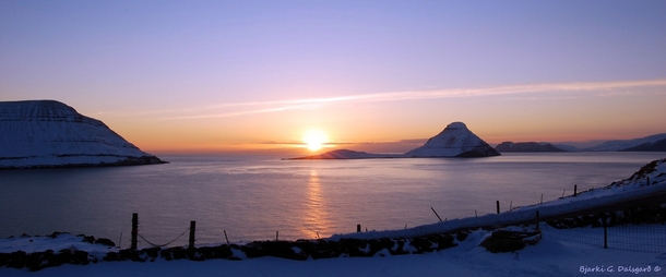 Kitchen view winter sunset Velbastaur Faroe Islands 