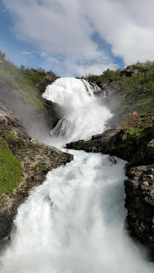 Kjossfossen waterfall in Norway visited with the Flm Line Railway 