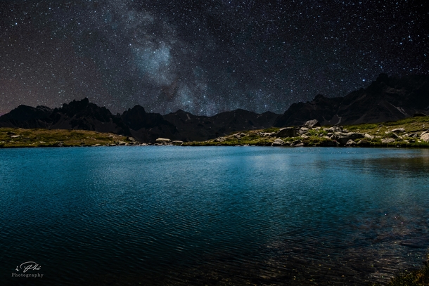 Lake Laramon under a starry night sky The Alps France 