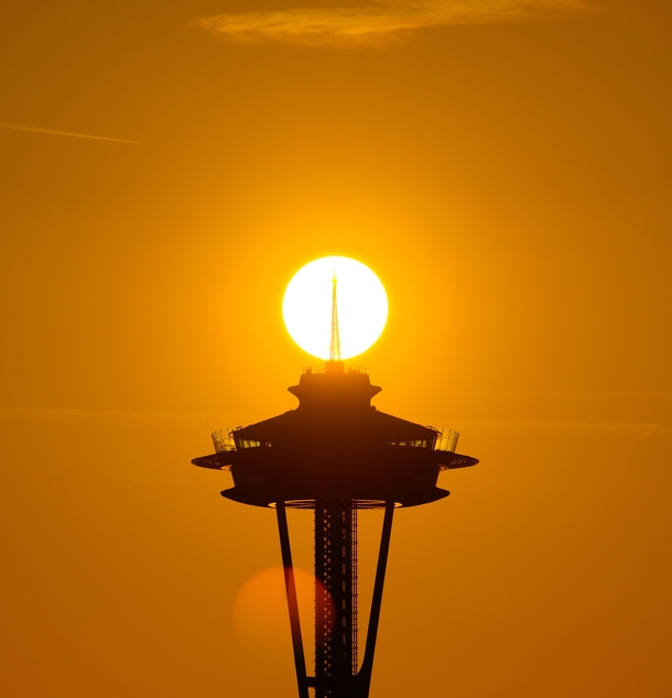 Last night from a spot near my house in Seattle the sun aligned with the Space Needle 