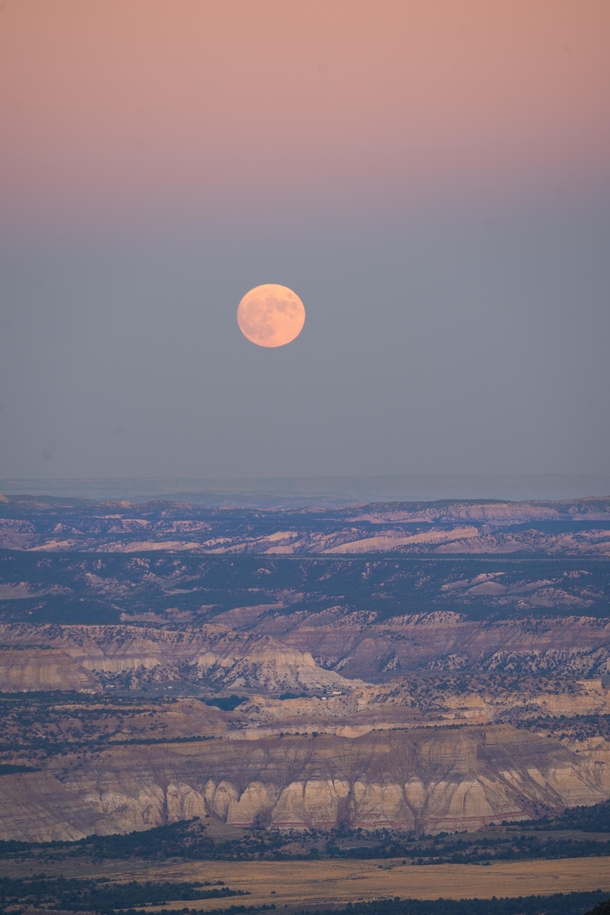 Last nights full moon rising over the edge of Bryce Canyon at dusk 