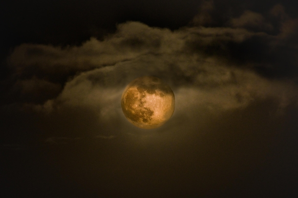 Last nights moon from Norway A bit cloudy but I though it looked huge on the night sky Used my Nikon d with a tamron -mm lens One shot at s shooting the clouds and one at  for the moon then prosessed in photoshop Hope you enjoy my work