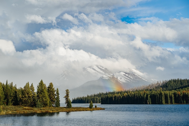 Last rays of a rainbow over Maligne Lake Jasper Canada 