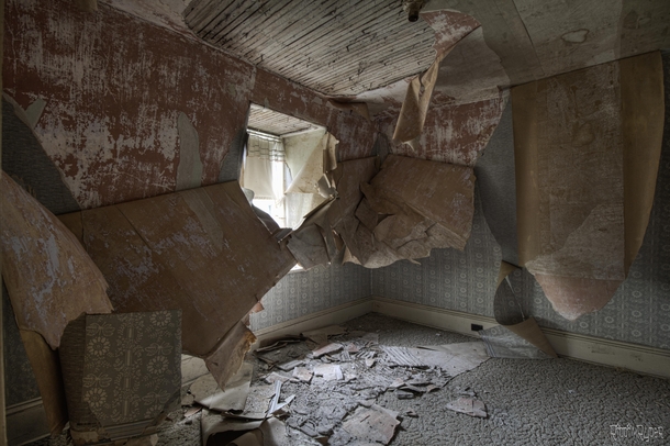 Layers of Wallpaper Falling Down Inside an Abandoned French Countryside Manor 