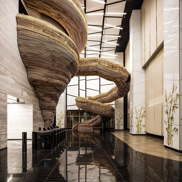 Lobby of Atrium Tower in Tel Aviv Israel What are your thoughts on this wooden staircase
