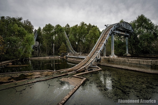Log flume ride at abandoned amusement park 