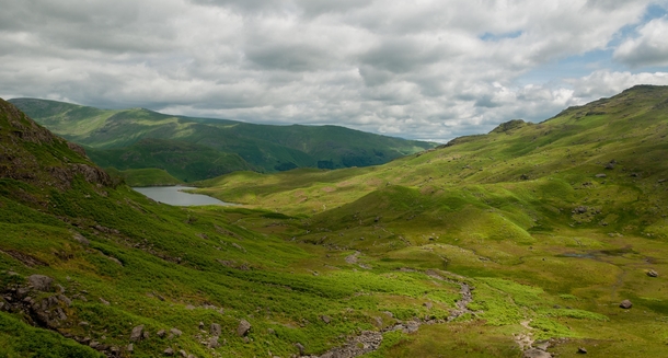 Looking down towards Easedale Tarn and Grassmere Lake District UK 