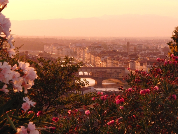 Looking out from the Piazzale Michelangelo as the sun sets over Florence Italy 