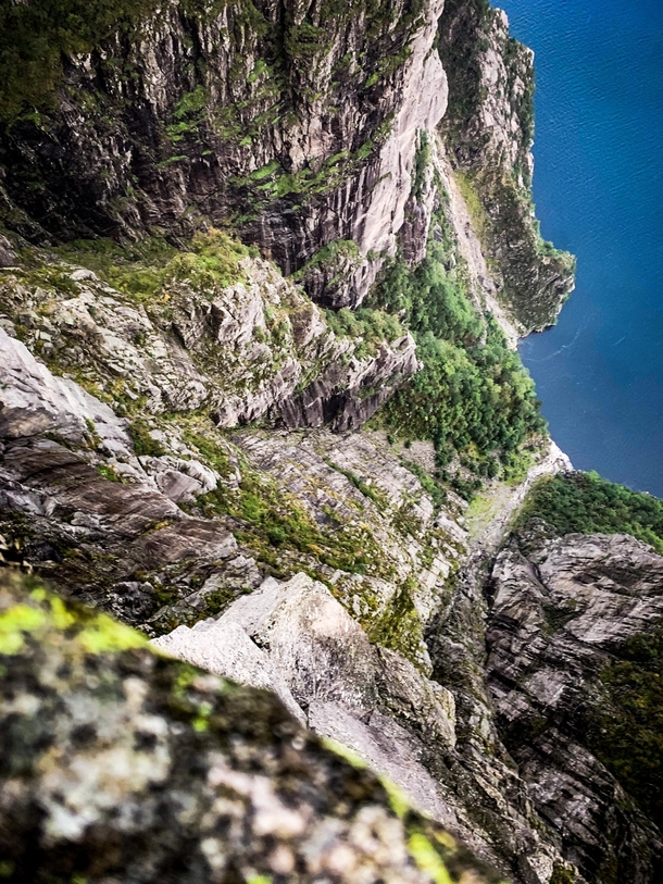 Looking over the edge of famous Preikestolen in Norway - straight down about ft  meters  - more info in the comments