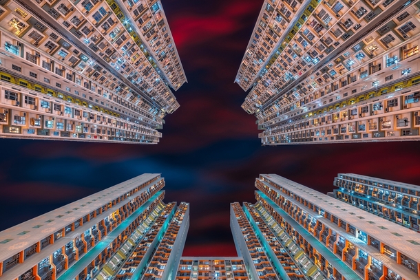 Looking up in an apartment complex in Hong Kong  by Peter Stewart 