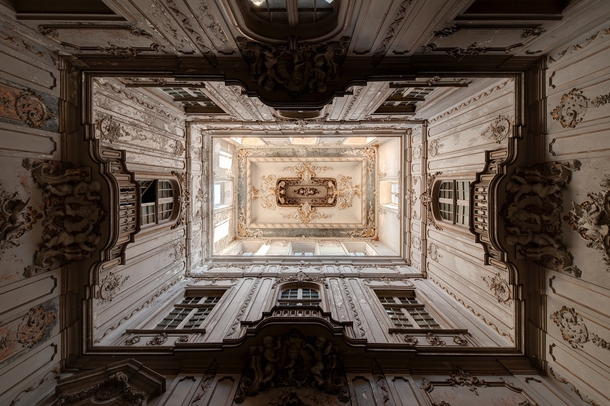 Looking up the stair hall of an abandoned palace  Photographed by Francis Meslet MIC