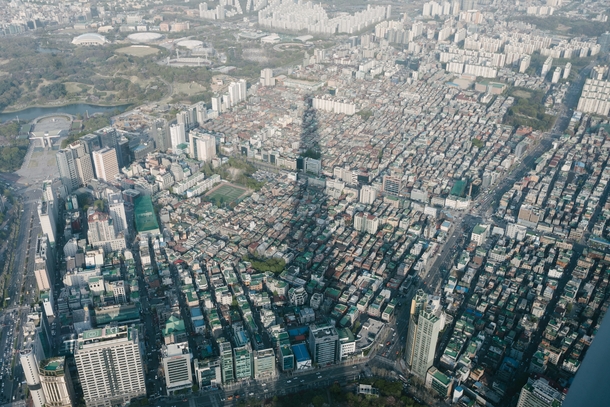 Lotte World Tower casts a giant shadow over Songpa District Seoul South Korea 