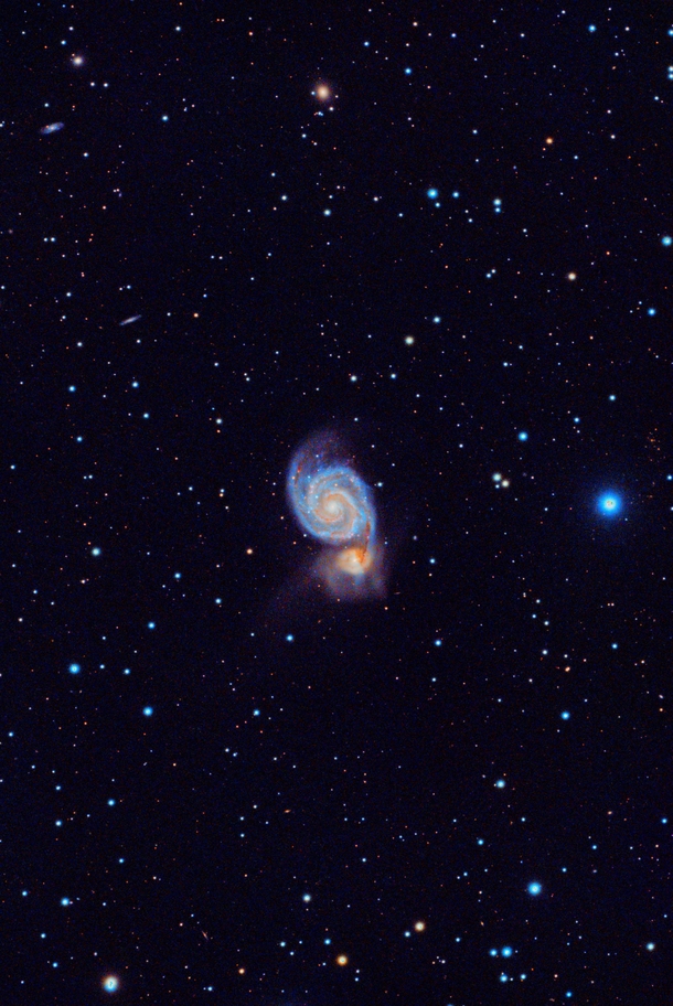 M The Whirlpool Galaxy gobbling up its galactic neighbor details in comments 