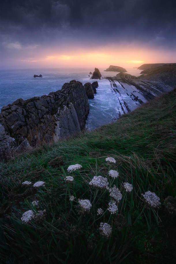 Magical sunrise above the rugged coastline of norther Spain Santander 