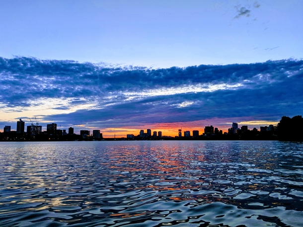 Metallic water under a vibrant sunrise in Boston 