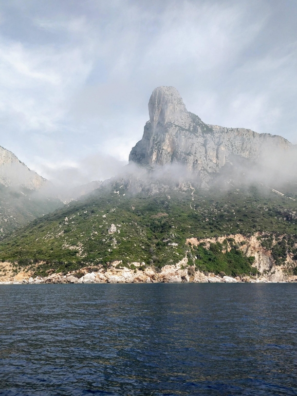 Mid morning view of the wild eastern Ogliastra coast of Sardinia Italy This is one of the coastal peaks in the National Park of the Gulf of Orosei and Gennargentu which can only be reached by the sea 
