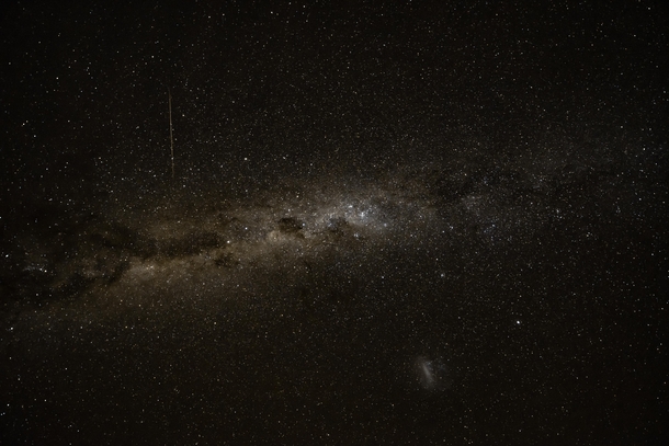 Milky Way band across the southern hemisphere night sky with a dwarf galaxy taken at Tekapo New Zealand 