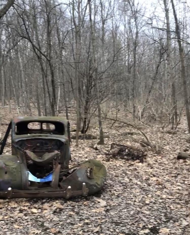 Most likely a s vehicle abandoned in the preserved natural lands of Ithaca NY