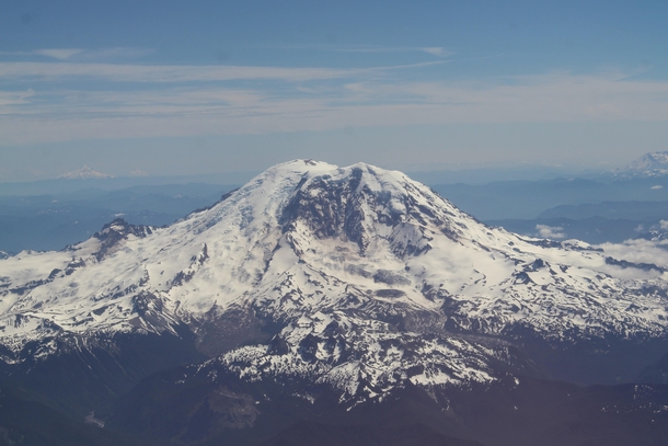 Mount Rainier and friends on a clear summer day shot from a plane 