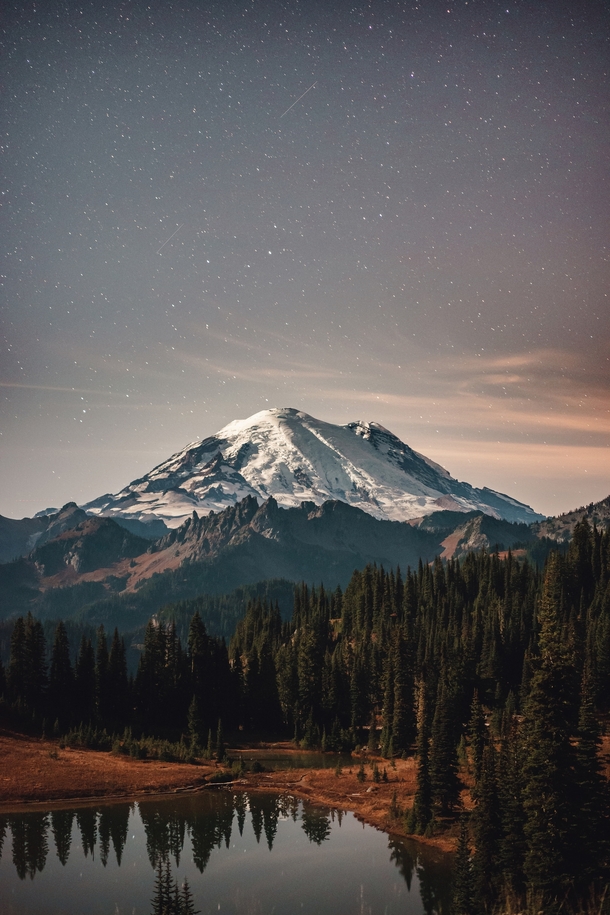 Mount Rainier under a starry sky  Photographed by Bryan Buchanan