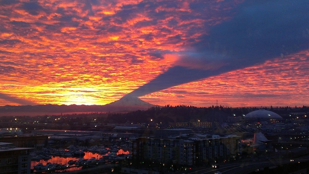 Mt Rainier in Washington state casting a shadow at sunset