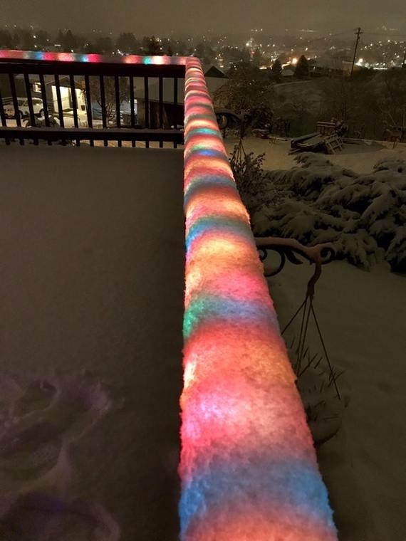 Multicolored LED lights covered with snow