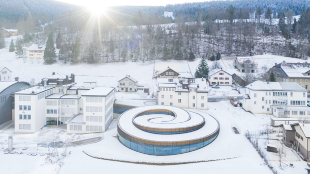 Muse Atelier Audemars Piguet is a spiral-shaped building rising up out of the landscape of Valle de Joux in Switzerland designed by BIG for the watchmaker to house its collection of timepieces